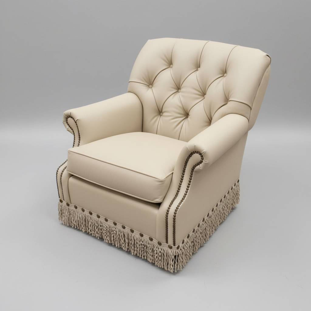 Beige armchair with tufted backrest and fringe details on a gray background