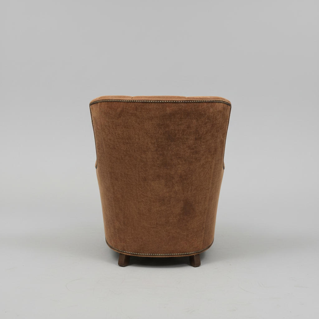 Brown armchair on a gray background