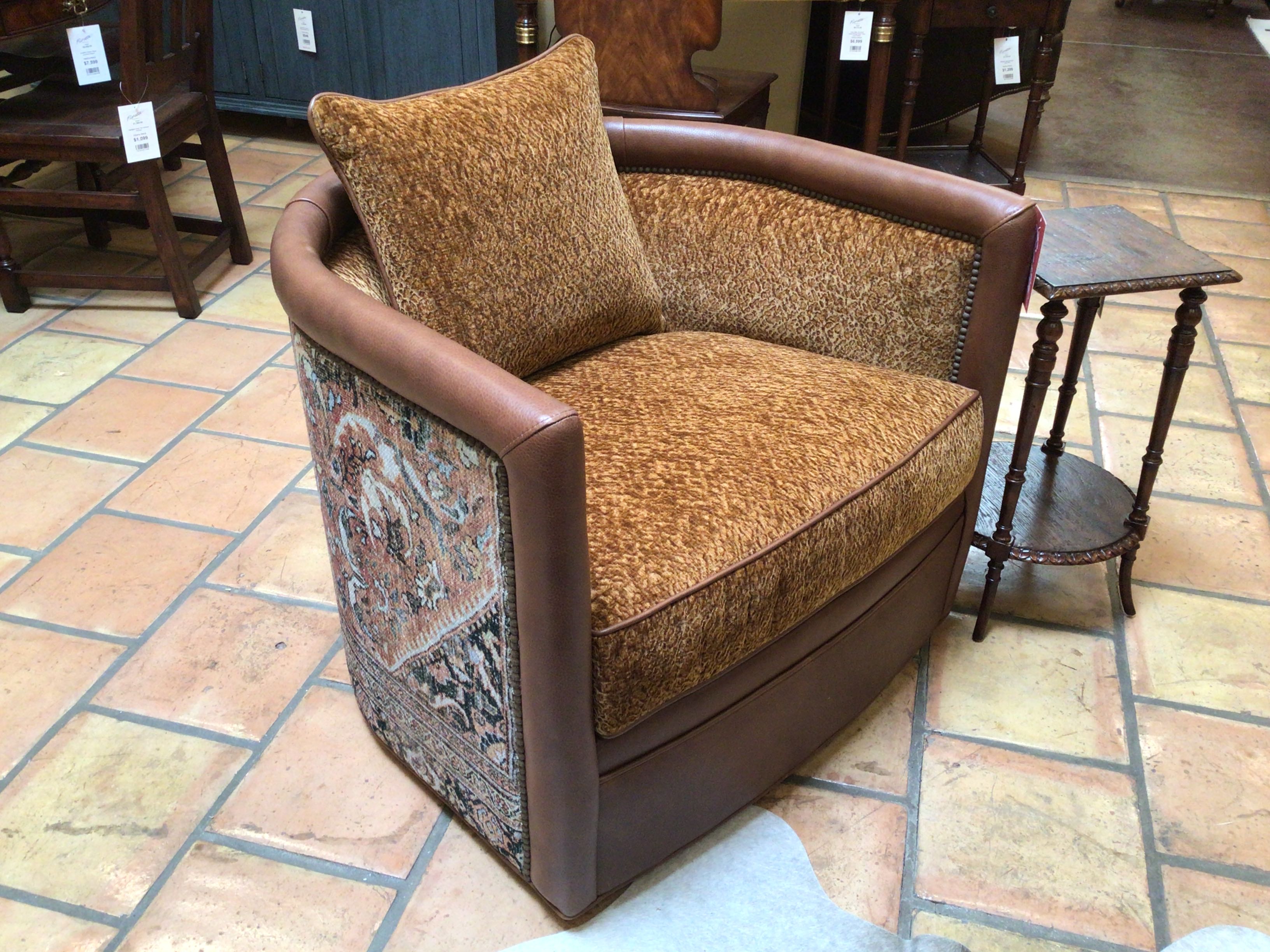 Brown armchair with patterned fabric on a tiled floor