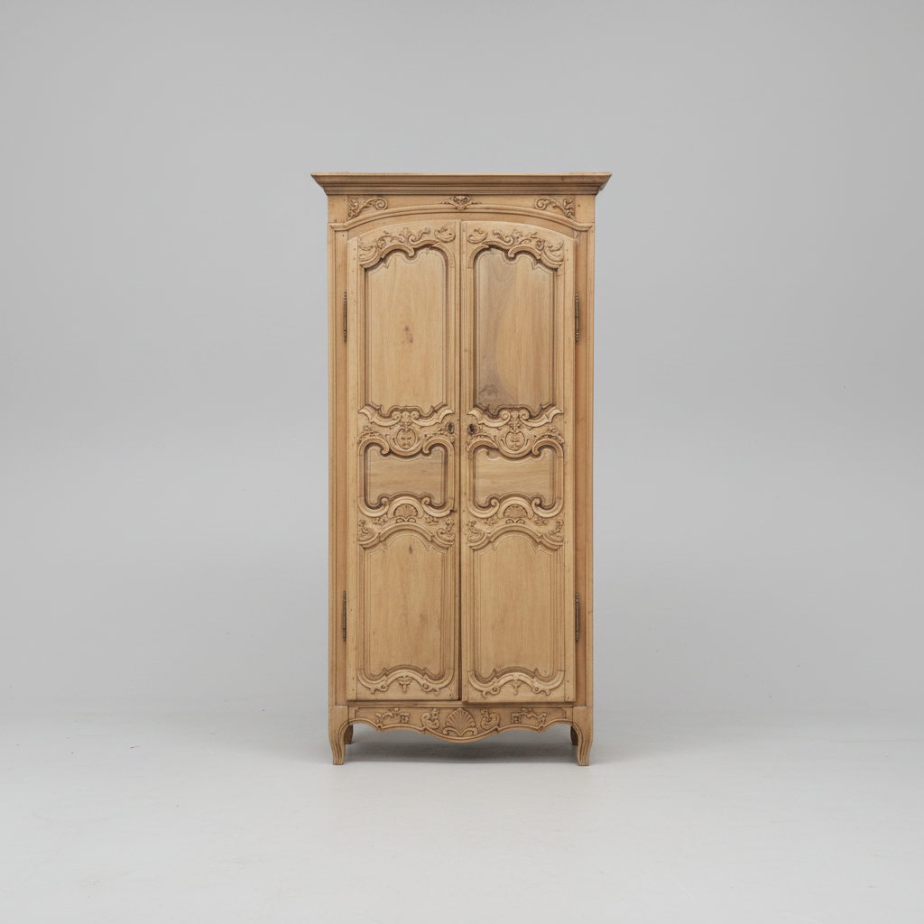 Wooden wardrobe with intricate carvings on a gray background