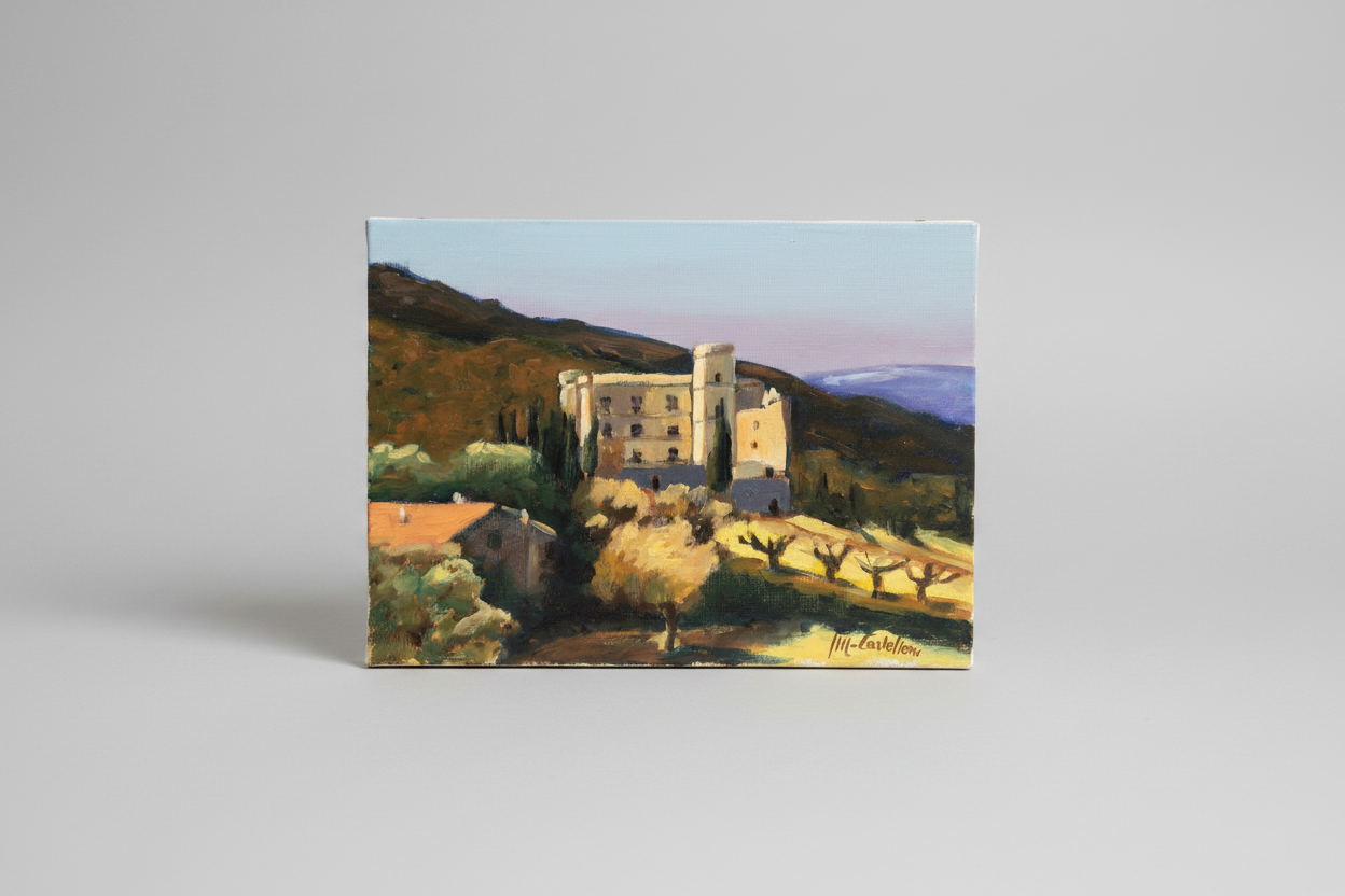 Painting of a castle in a landscape on a card with a gray border.