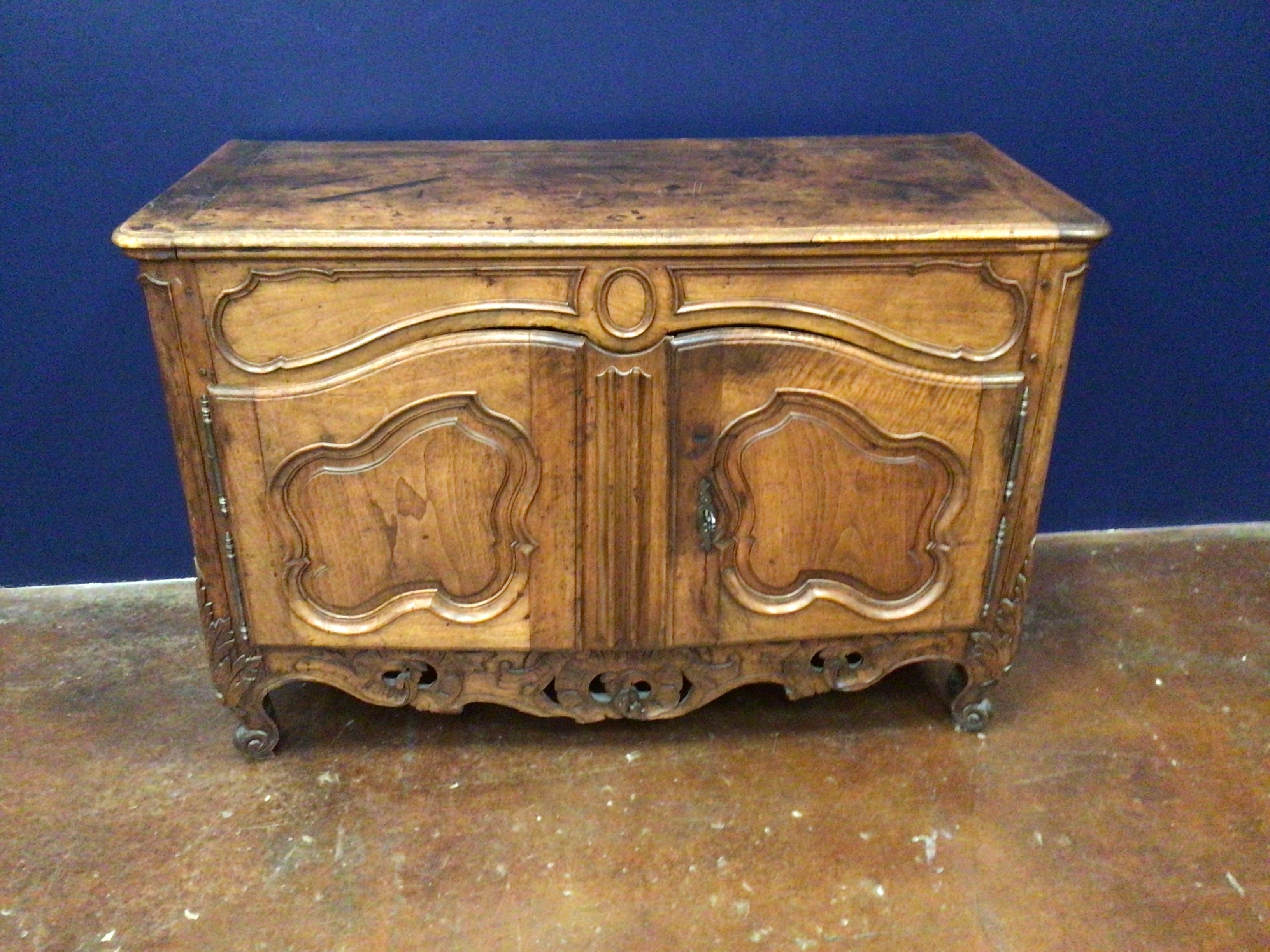 Wooden chest with intricate carvings on a blue background