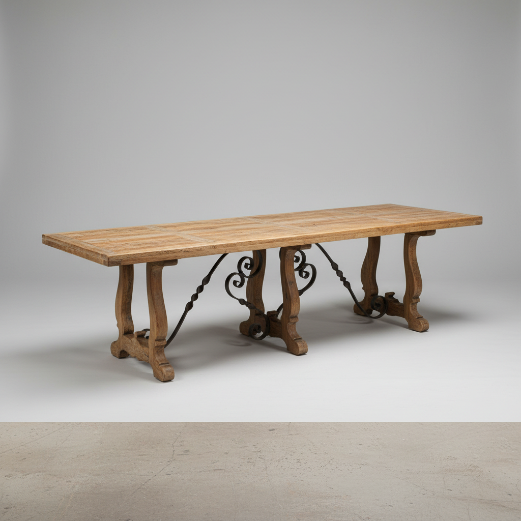 A rustic wooden dining table with a light oak rectangular top and three carved dark metal trestle legs, photographed in a studio setting.