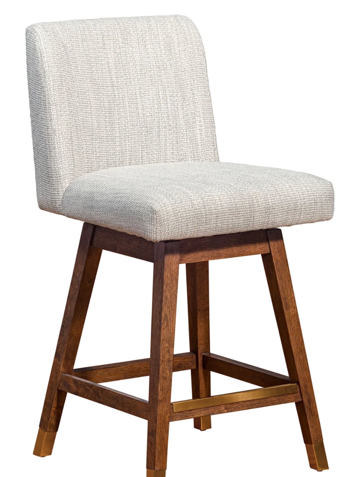 Bar stool with wooden legs and light gray cushioned seat on a white background
