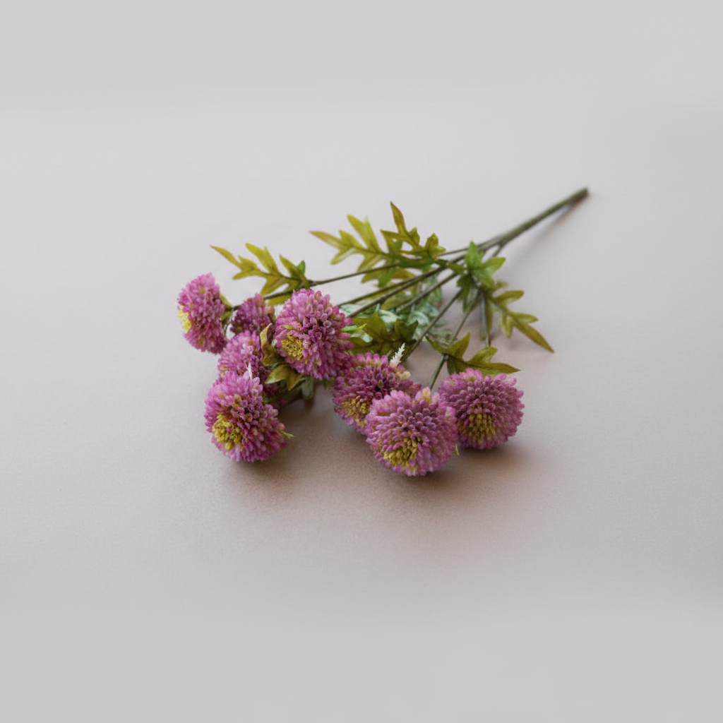 Bouquet of pink flowers with green leaves on a light gray background