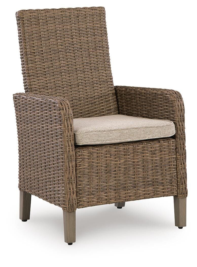 Wicker armchair with cushion on a white background