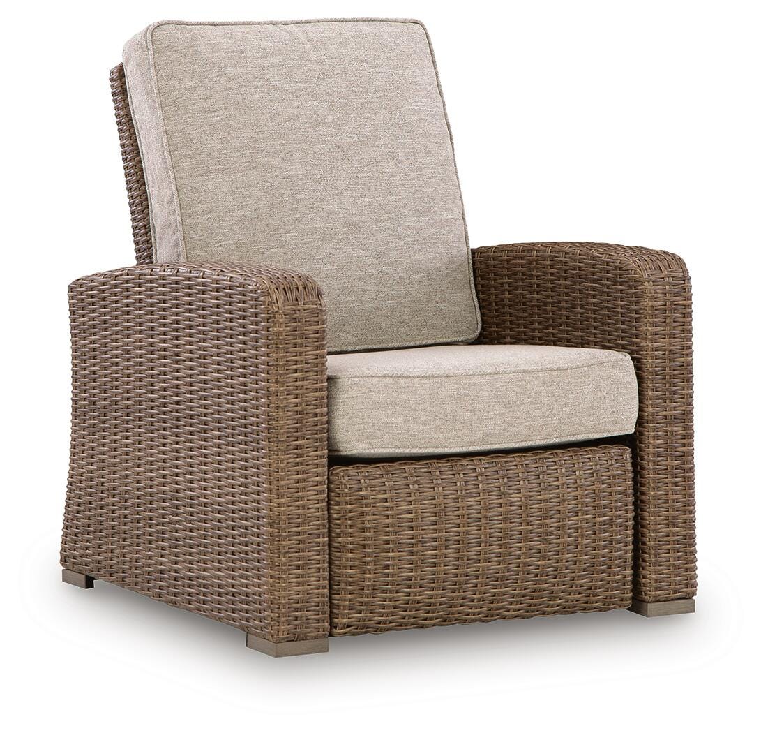 Wicker armchair with beige cushions on a white background