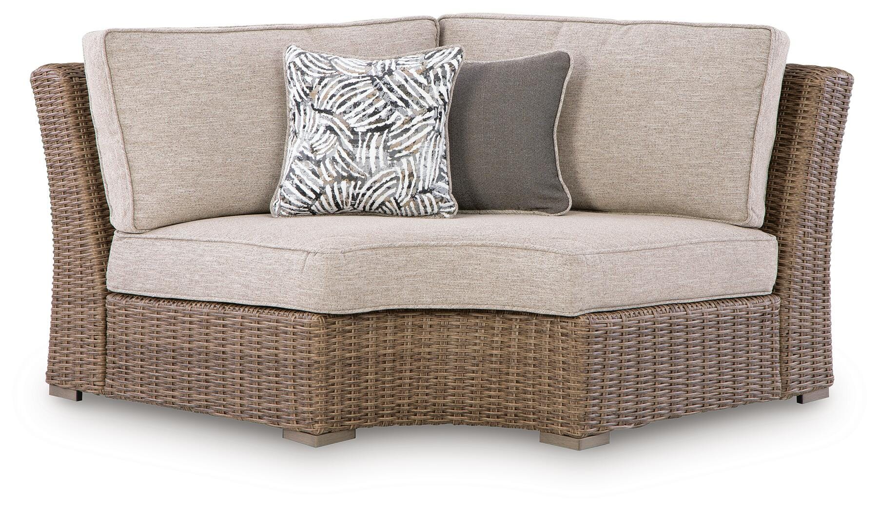 Wicker outdoor sofa with cushions on a white background