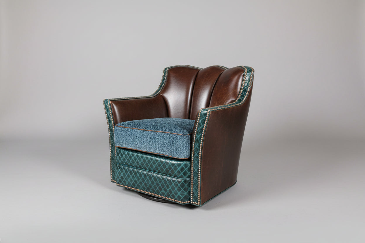 Chair with brown leather and blue fabric on a gray background