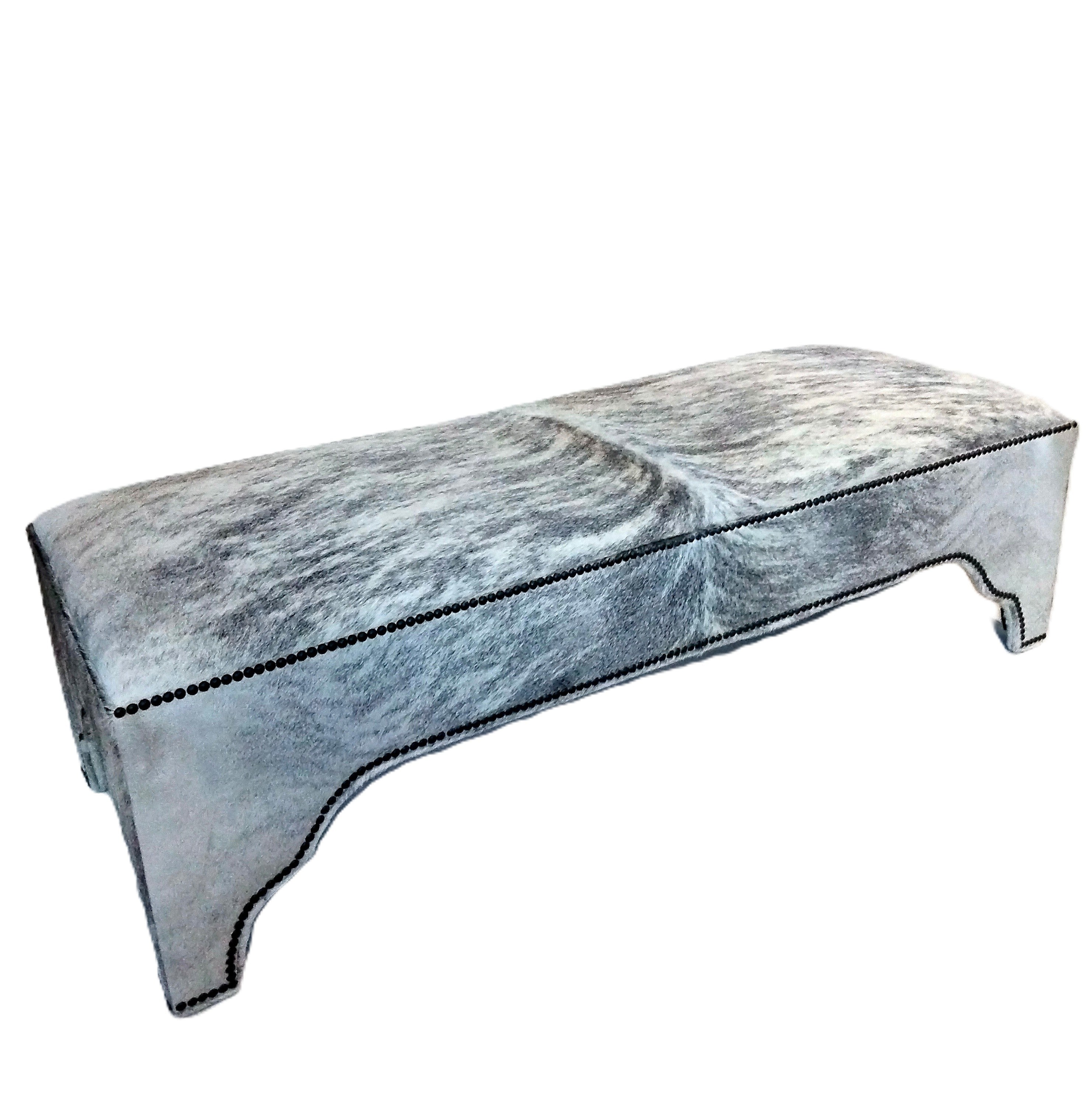 Marble-patterned cowhide bench on a white background