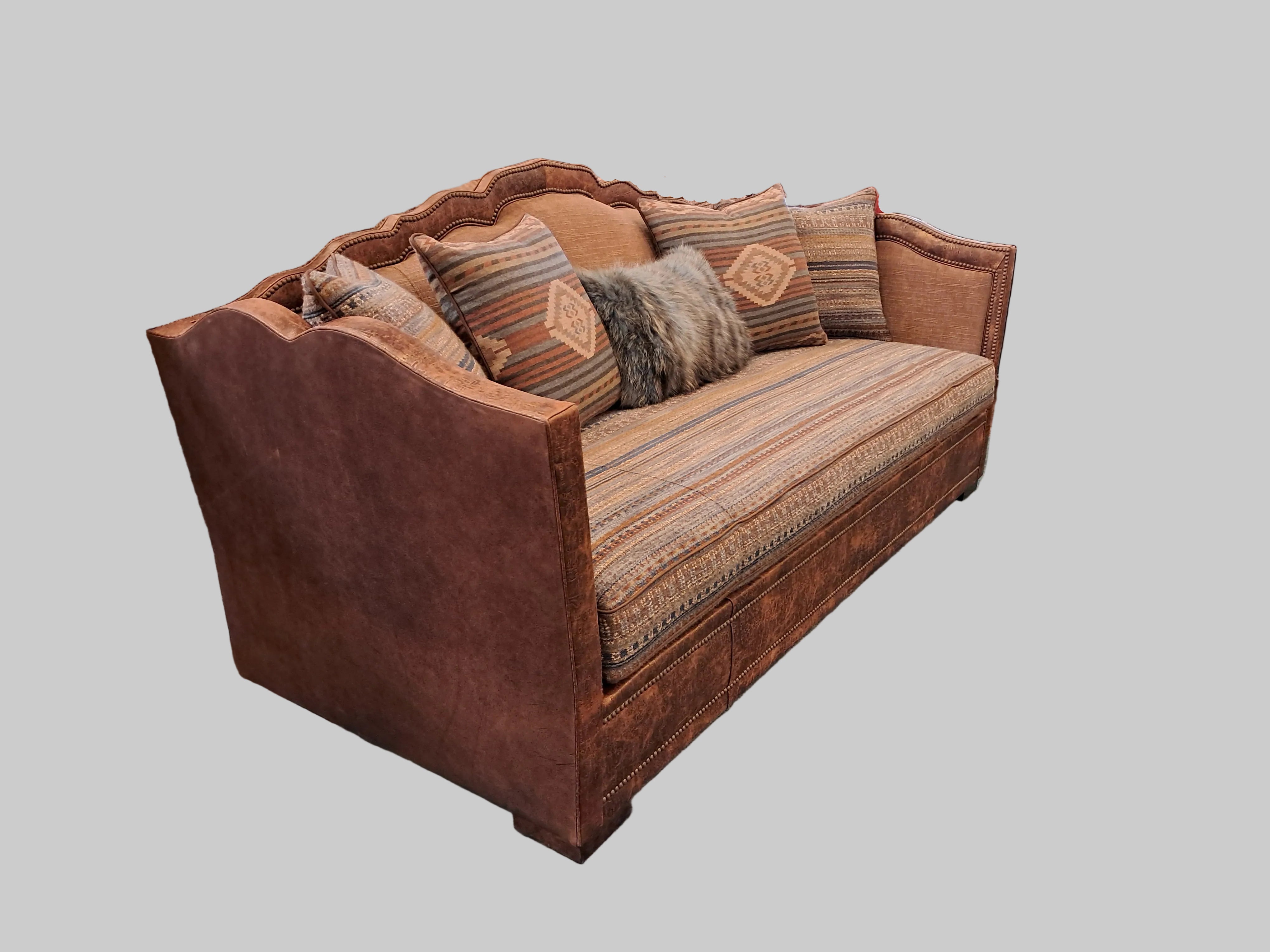 Brown sofa with patterned cushions on a gray background