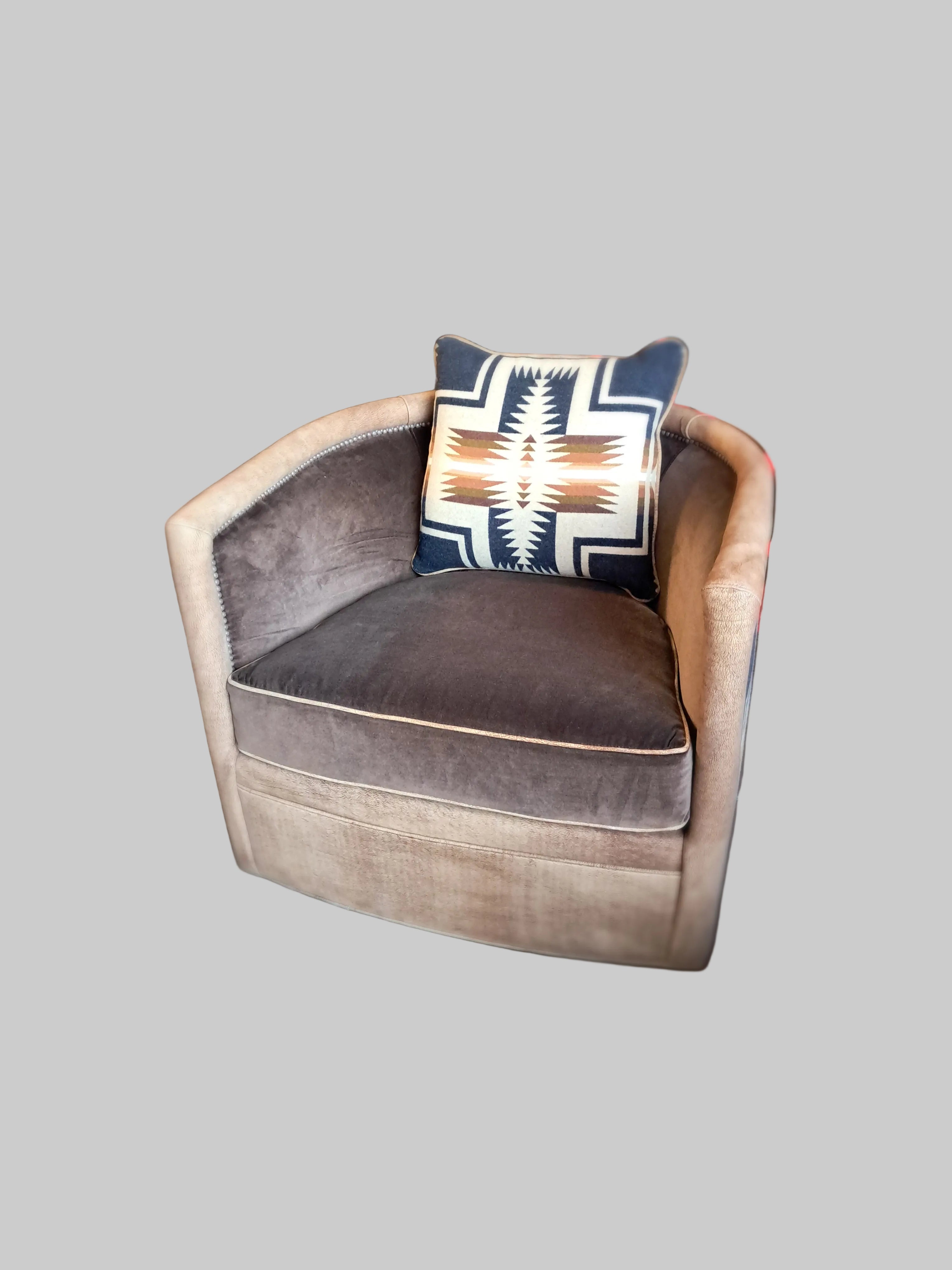 Brown cushion with a patterned pillow on a chair in an indoor setting