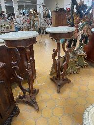 Pair of Italian pedestal stands with circular marble tops on carved walnut tripod bases