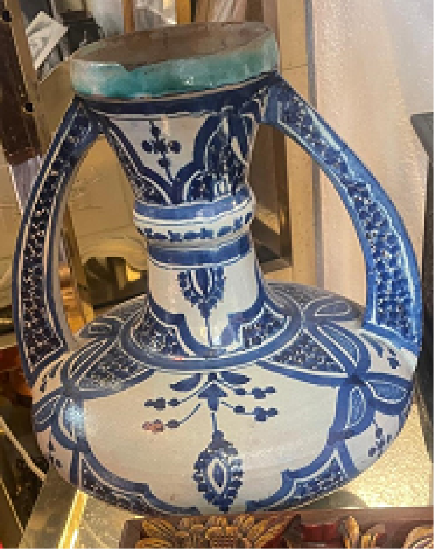 Moroccan blue and white glazed water jar with twin loop handles and a turquoise rim