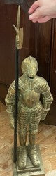 Bronze andiron modeled as an armored knight with a spear on a stepped base