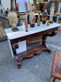 19th century French marble top console with a mahogany base on carved lion-form supports
