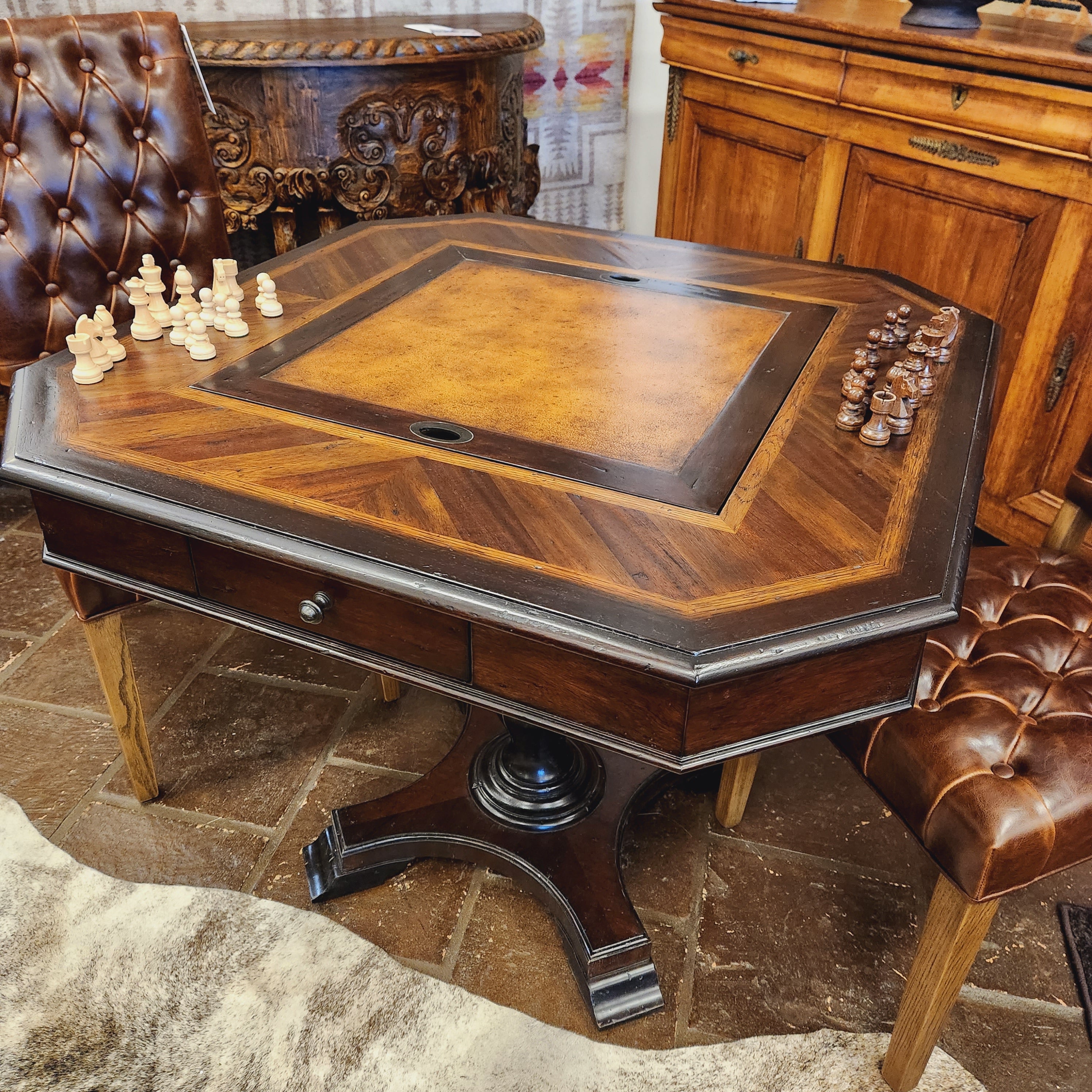 Wooden furniture with intricate carvings on a stone floor