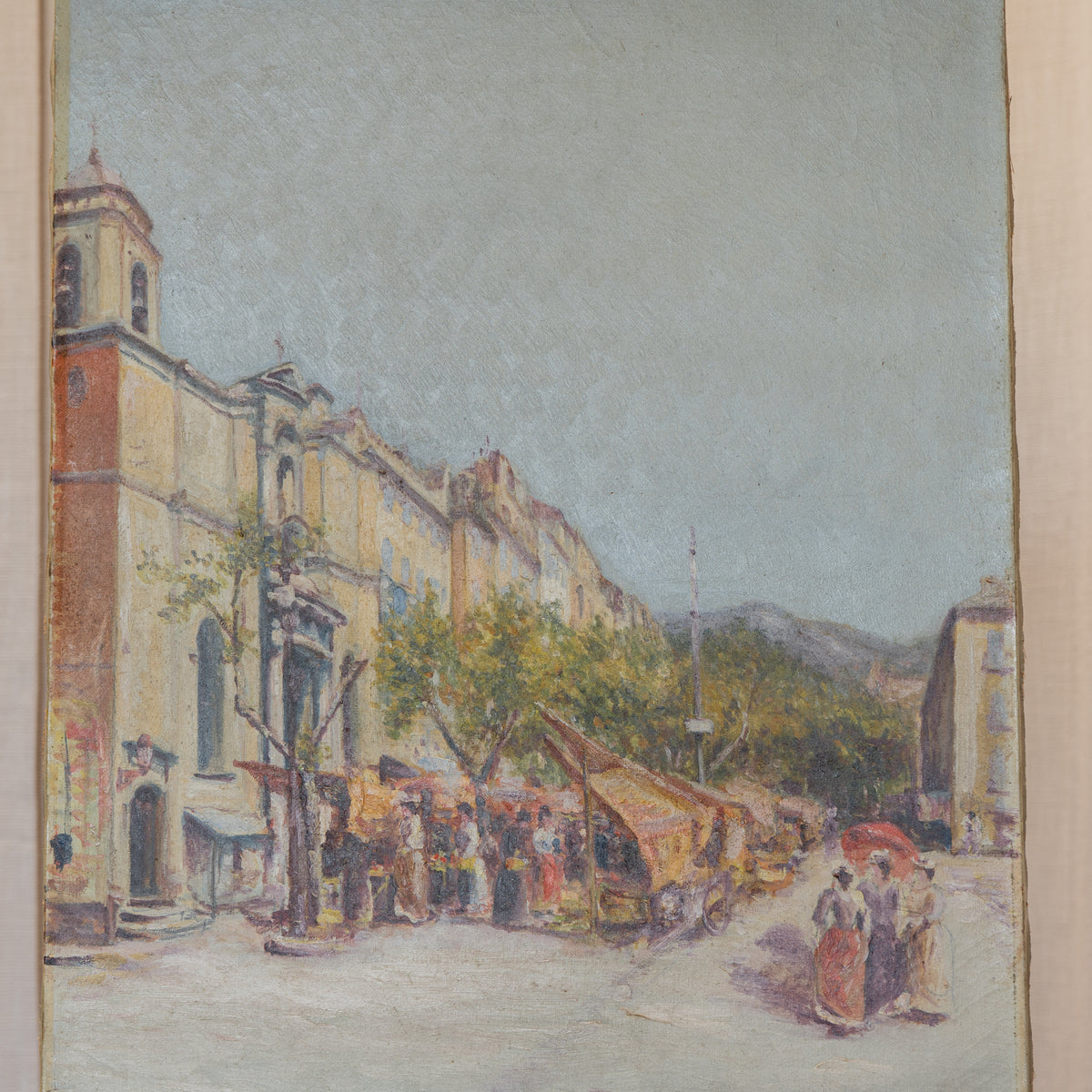 An impressionist-style painting of a street scene with a large building on the left, market stalls, trees, and a few figures walking under a pale sky.