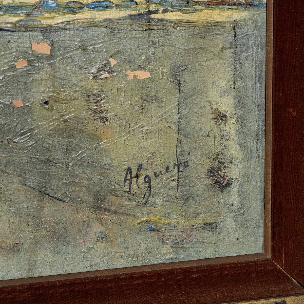 Close-up of a textured oil painting showing a beige and gray landscape with peeling paint details, a signature reading 'Aguedo', and a dark brown wooden frame.