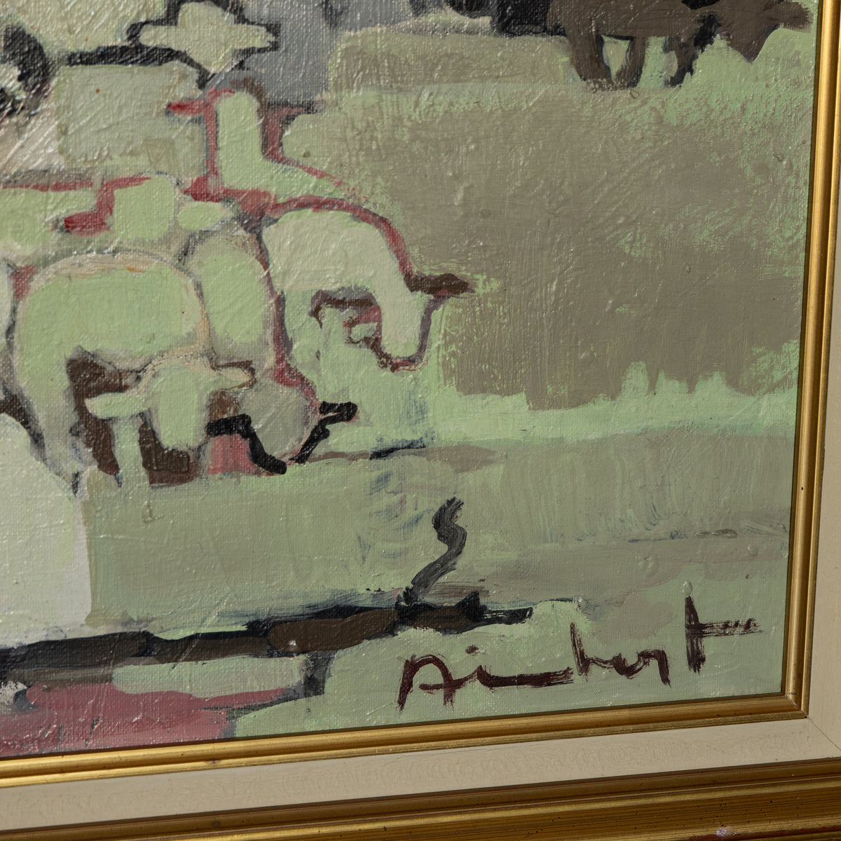 A close-up of a framed painting showing an abstract scene with pale green, gray, brown, and pink brushstrokes, plus a gold frame and a visible artist signature near the bottom.
