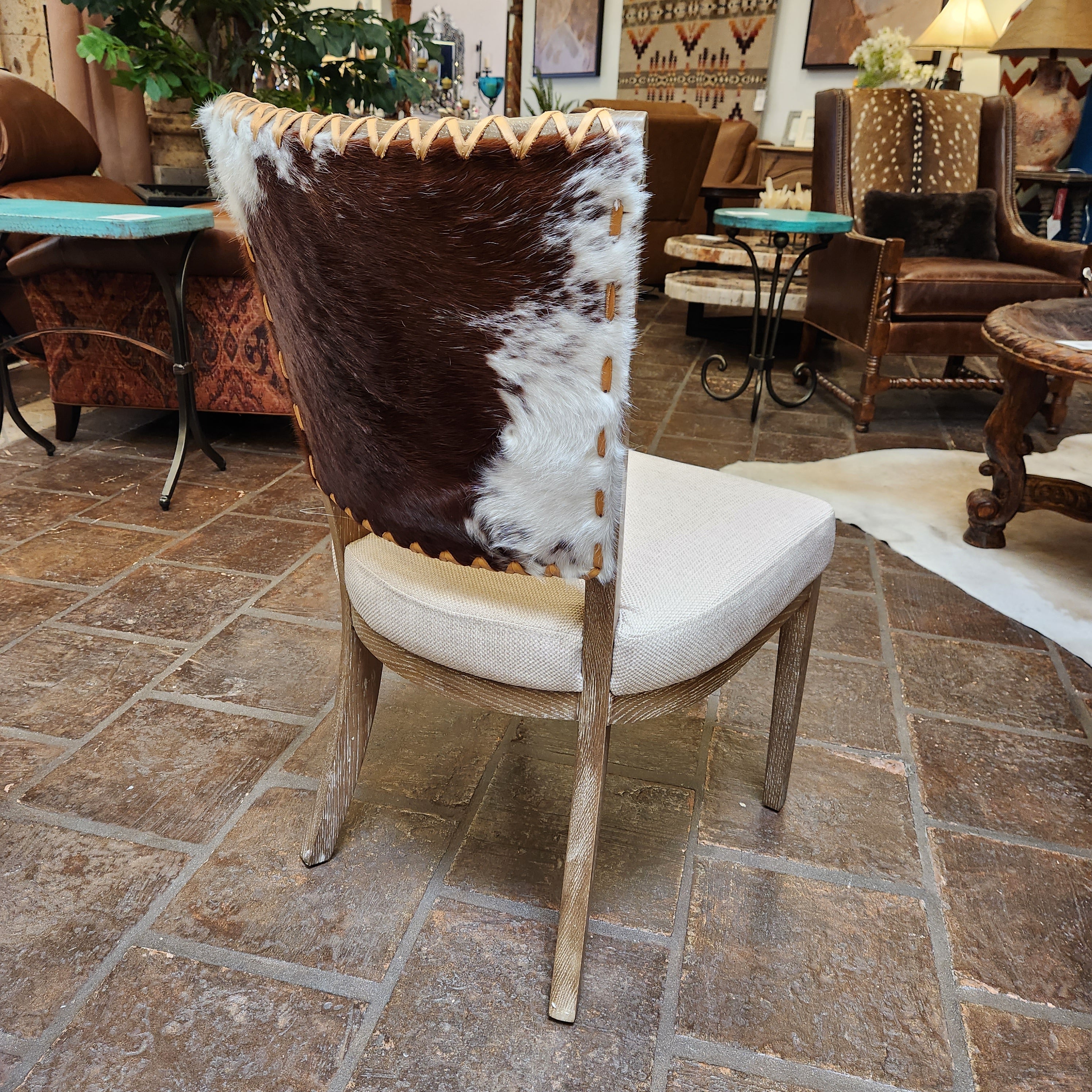 Chair with cowhide pattern on a stone floor