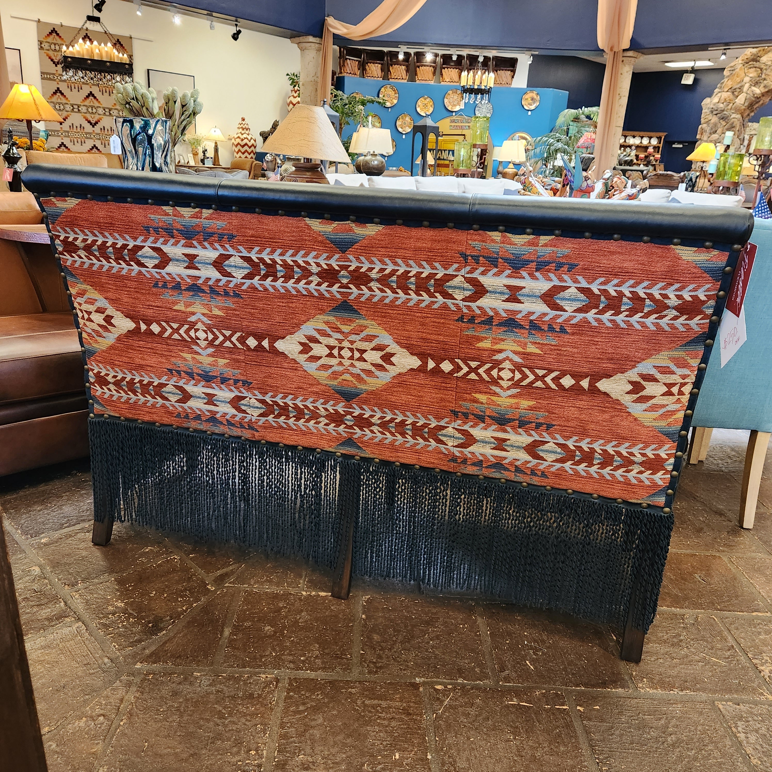 Decorative bench with a patterned cover in a store setting
