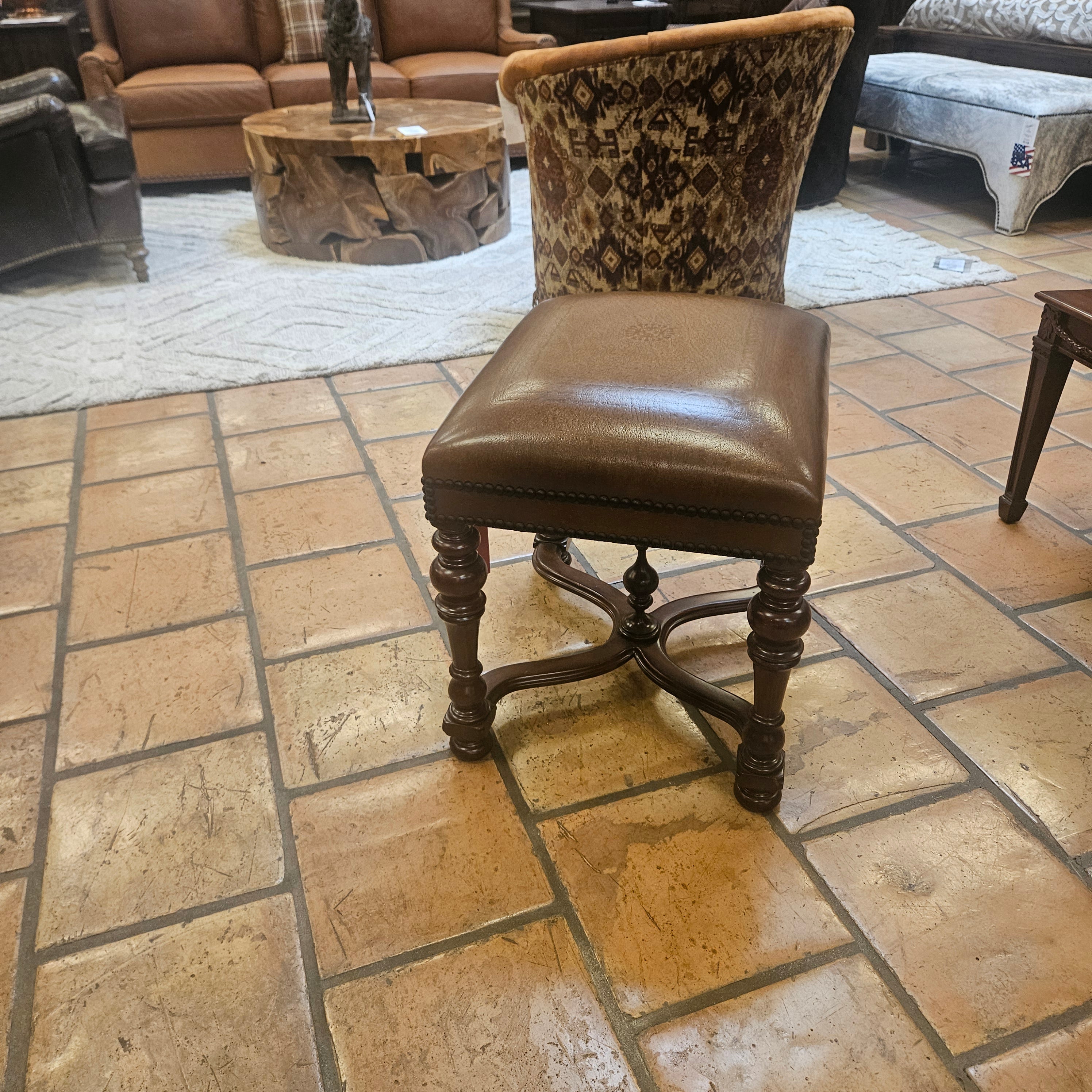Brown leather chair on a tiled floor